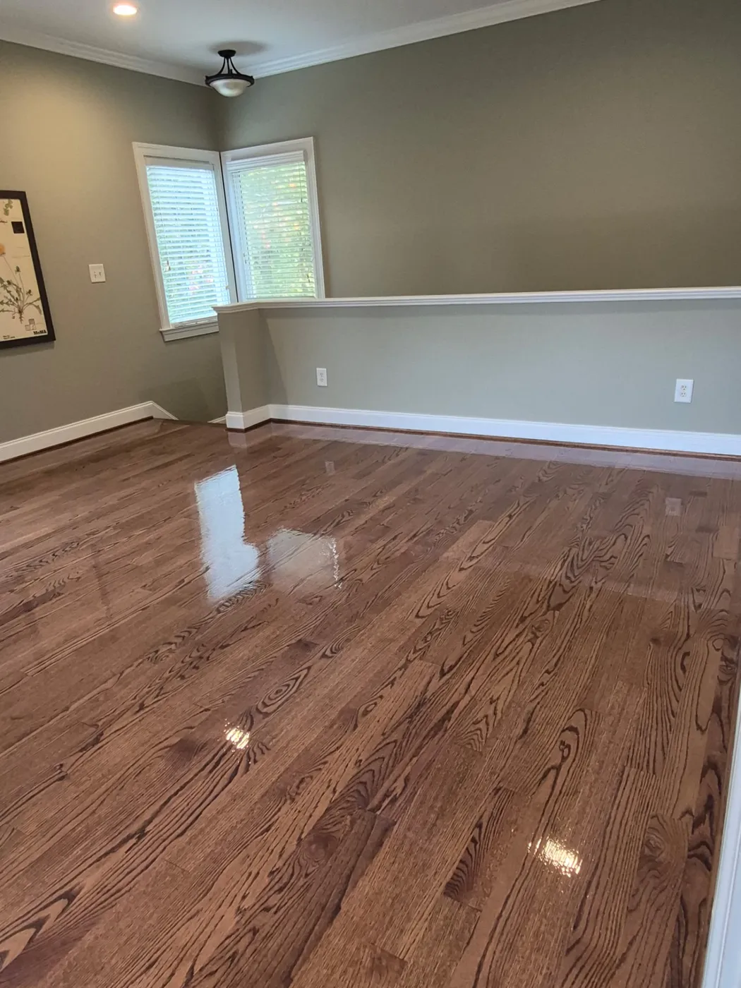Open room with glossy oak hardwood